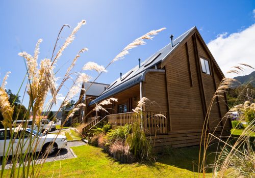 Mountain wooden lodge apartment exterior. Fox Glacier Lodge, Fox Glacier, West Coast, South Island, New Zealand.